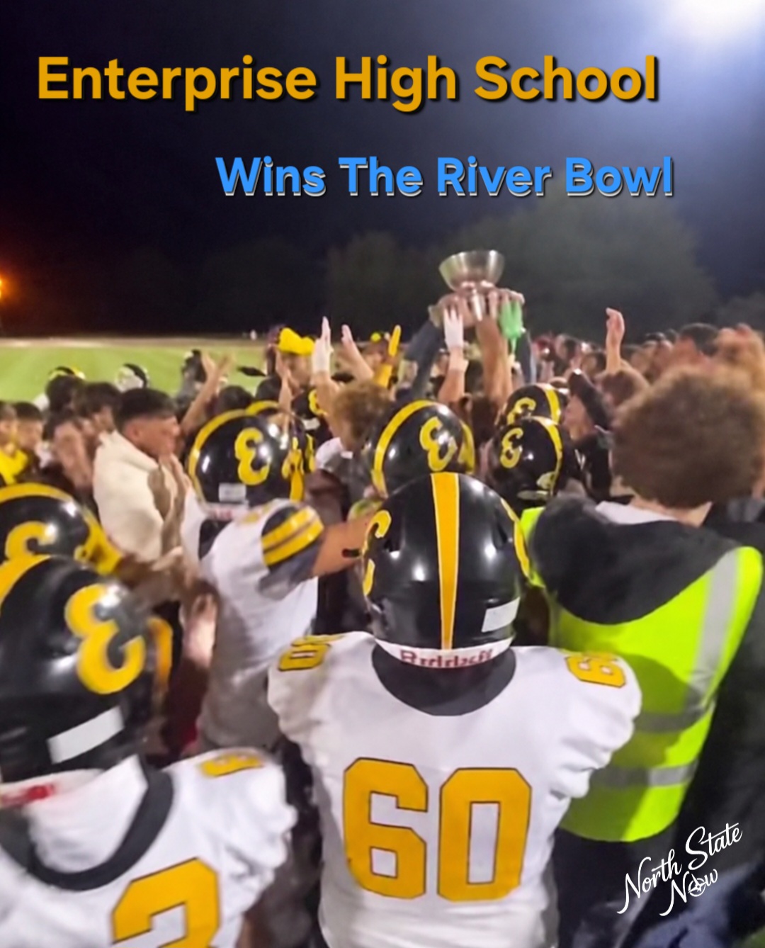 Enterprise players celebrate with the River Bowl trophy following their 42 to 7 victory over Shasta at Thompson Field, securing the Hornets’ third consecutive win in the annual Redding rivalry.